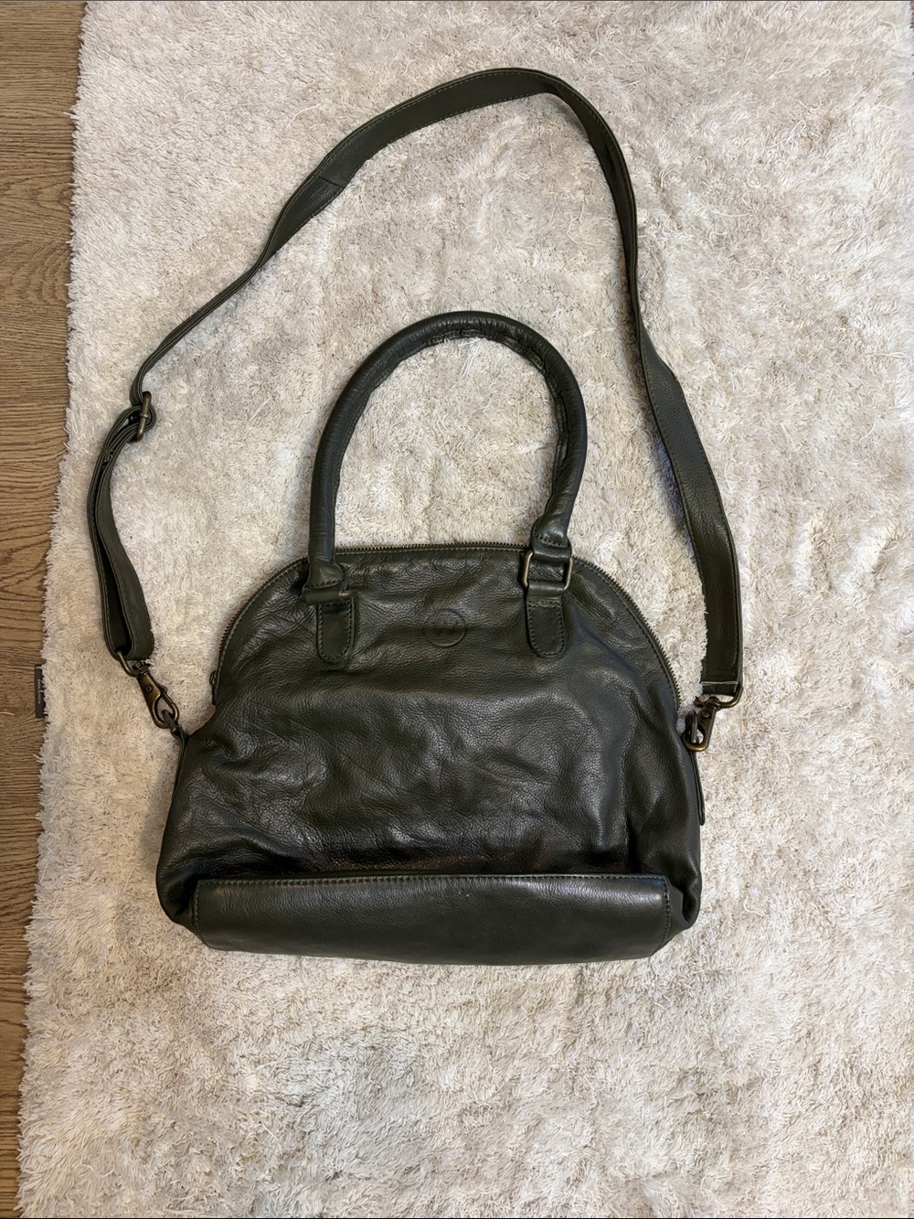 Wanderers Travel Co olive green bag.
